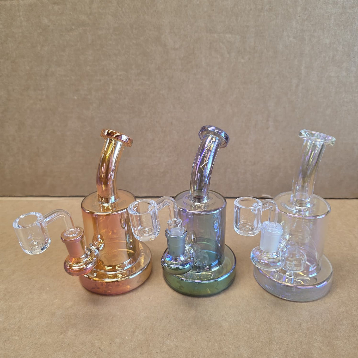 Close-up view of clear 14mm male quartz banger connected to transparent colored glass joint