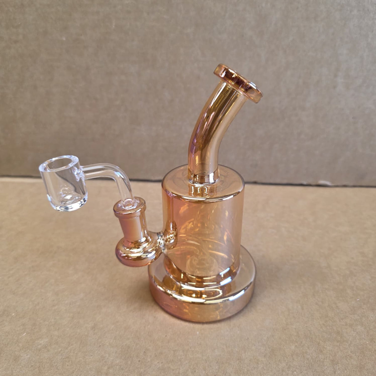 Angled view highlighting sturdy flat base and clear borosilicate glass build of dab rig