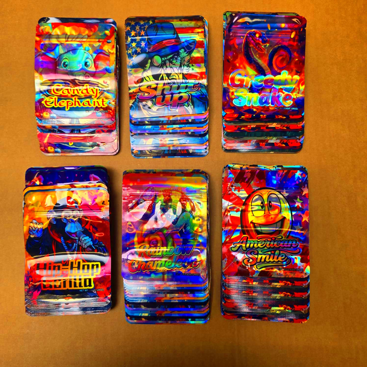 Stack of assorted colorful graphic print mylar bags showing 3.5 gram capacity