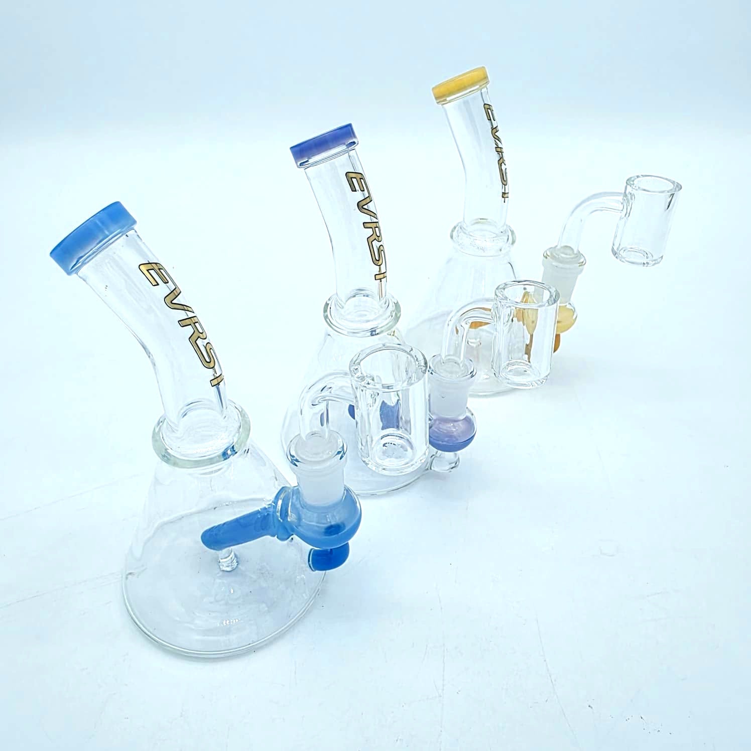 EVRST tube color dab rig water pipe with 14mm male banger featuring durable glass construction, water filtration, and smooth airflow for concentrate use.