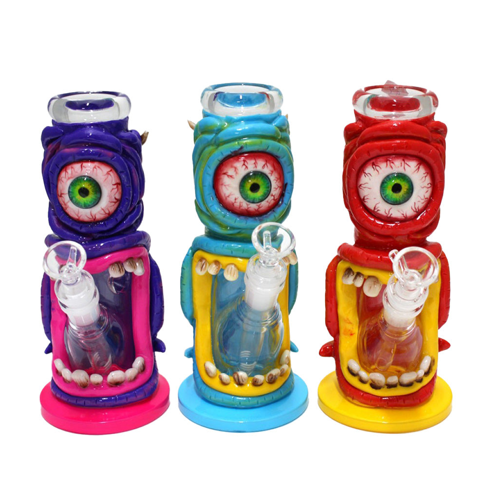 Monster design big eye decorated straight water pipe glass bong with detailed monster artwork durable straight tube construction and smooth airflow filtration system.