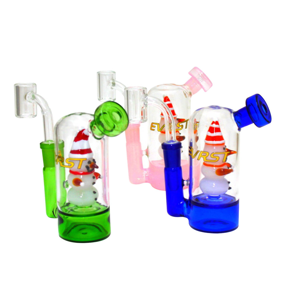 Small EVRST dab rig water pipe with 14mm male banger, compact durable glass design with water filtration for smooth and easy dabbing experience.