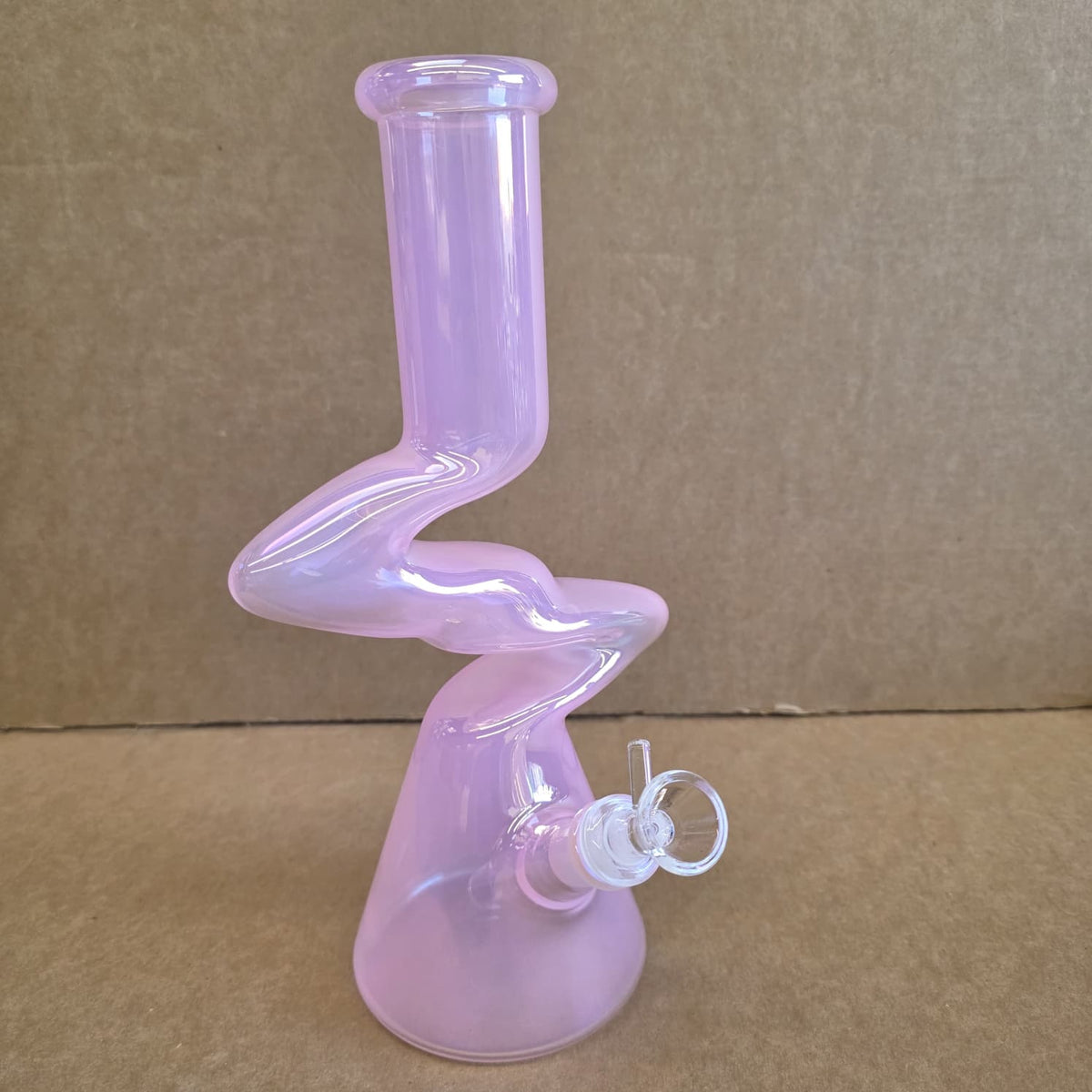 Detailed view of matching glass bowl piece and downstem joint on transparent beaker pipe
