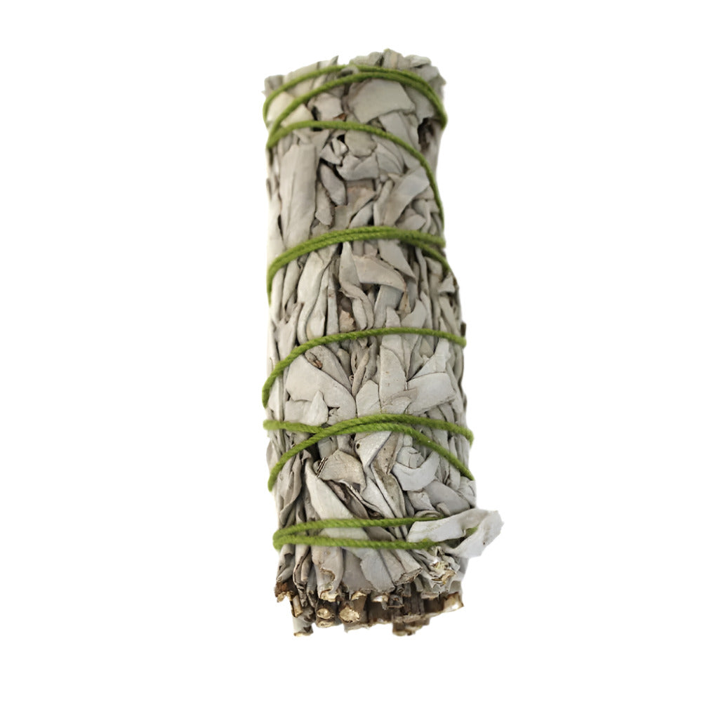 White Sage smudge stick natural cleansing herb bundle with earthy aroma used for spiritual purification meditation yoga and energy clearing rituals.
