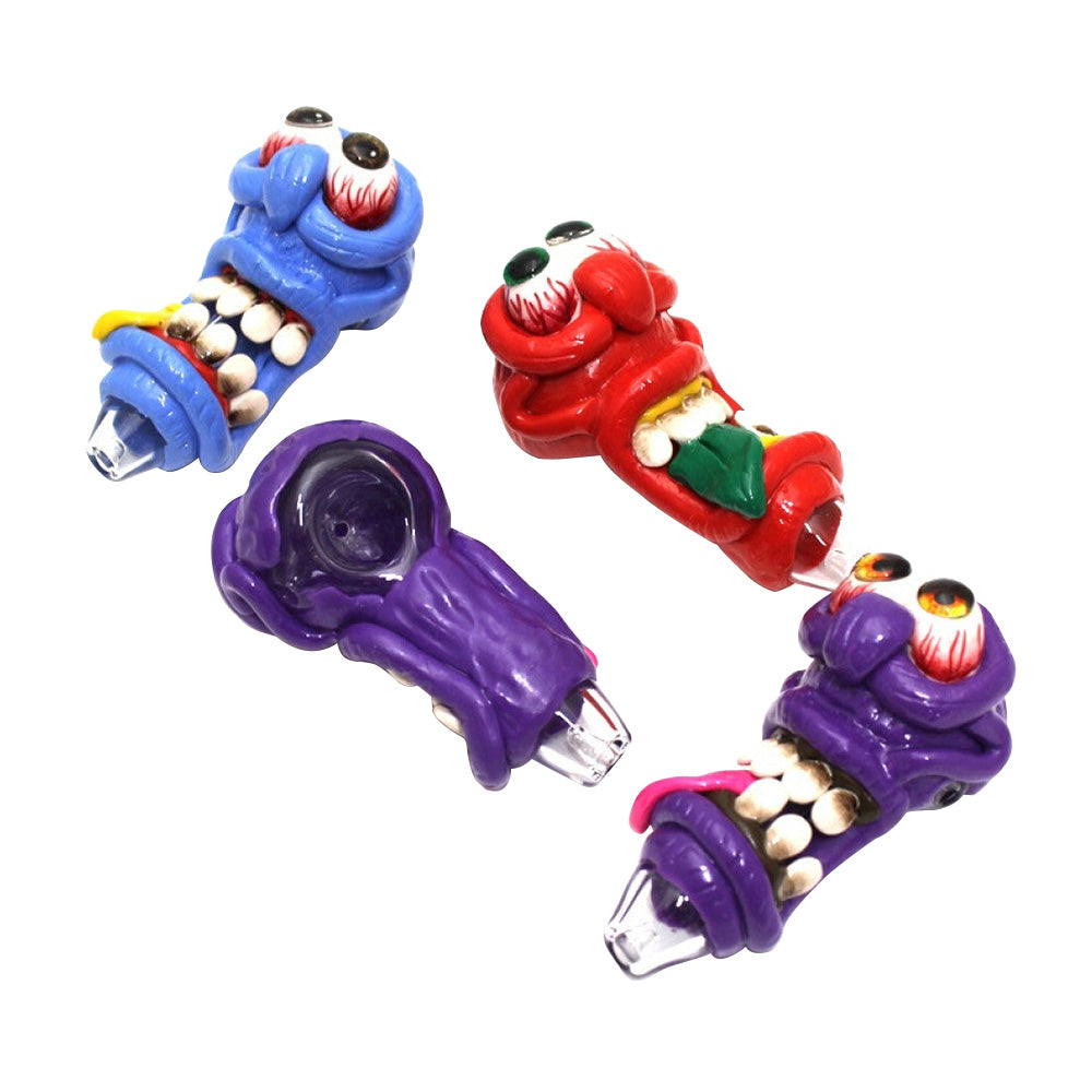 Artistic monster design heavy duty glass hand pipe crafted from thick durable glass with unique character-inspired detailing and premium workmanship.