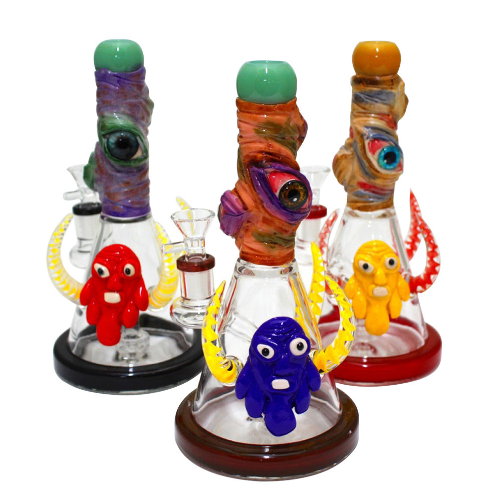 Beaker base water pipe with 3 horns and 3 eyes decorated glass bong monster themed design durable borosilicate glass construction with smooth water filtration system.