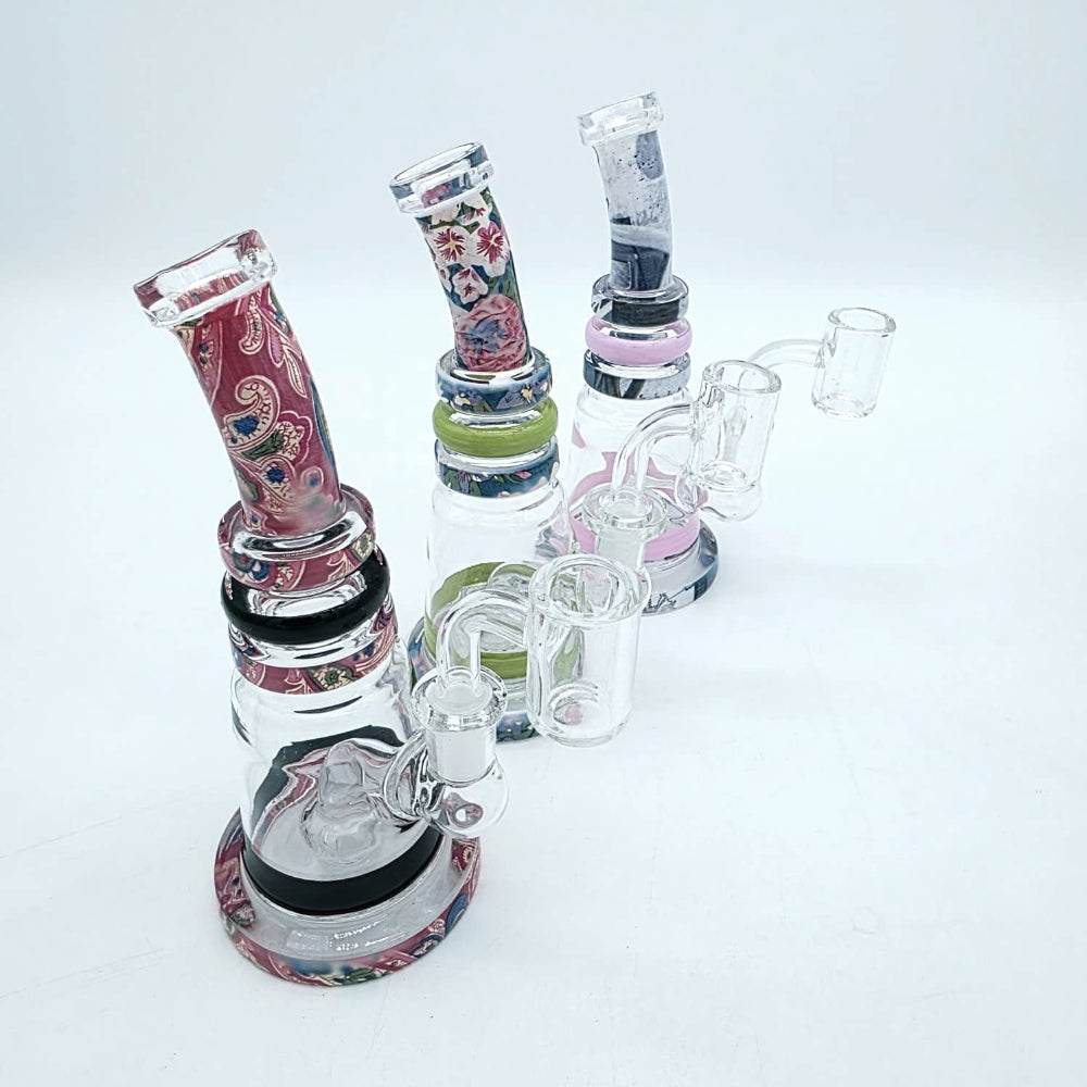 Bent fancy design dab rig water pipe with 14mm male banger featuring durable glass construction, water filtration, and stylish bent neck design.