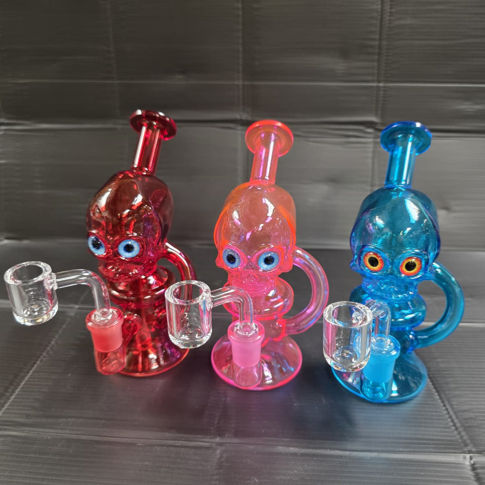 Character recycler glass dab rig featuring a unique design and recycler chamber for enhanced filtration.