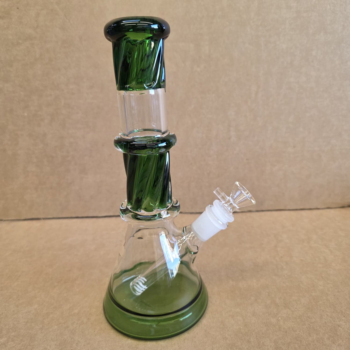 Angled profile showing wide stable beaker base chamber and clear downstem filtration setup