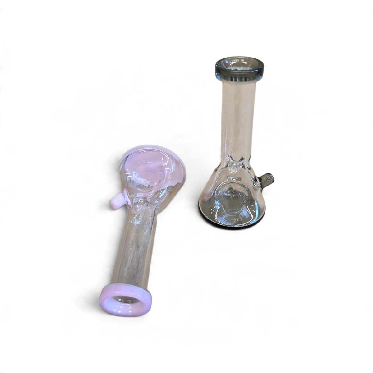 Handheld angle demonstrating pocket-sized scale and flared mouthpiece of dry glass hand pipe
