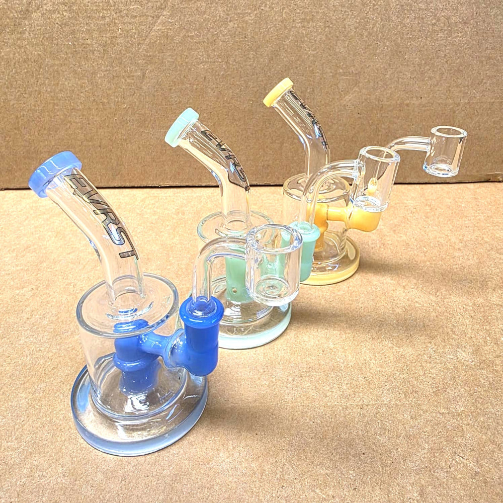 Dab rig water pipe with 14MM banger featuring durable glass construction, smooth water filtration, and compact design for concentrate use.