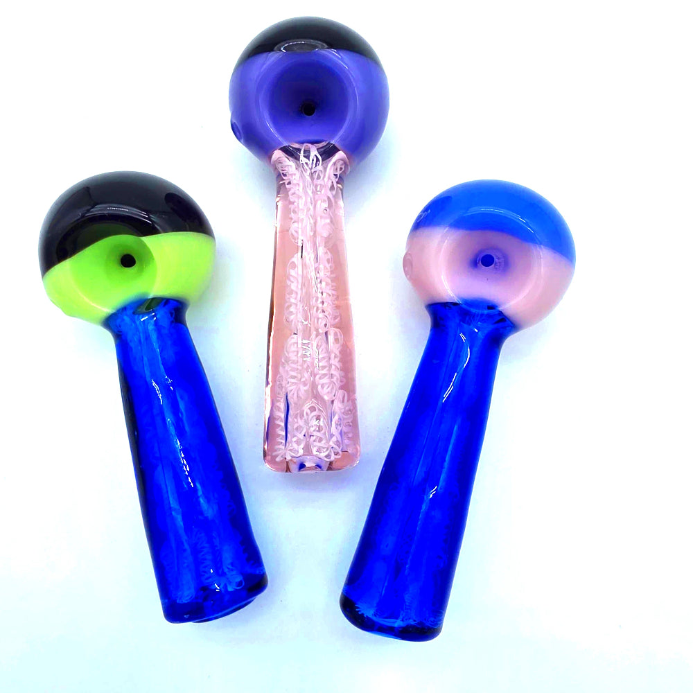 Double color heavy duty glass hand pipe made from thick durable glass with vibrant dual color design, compact shape, and smooth airflow for easy use.