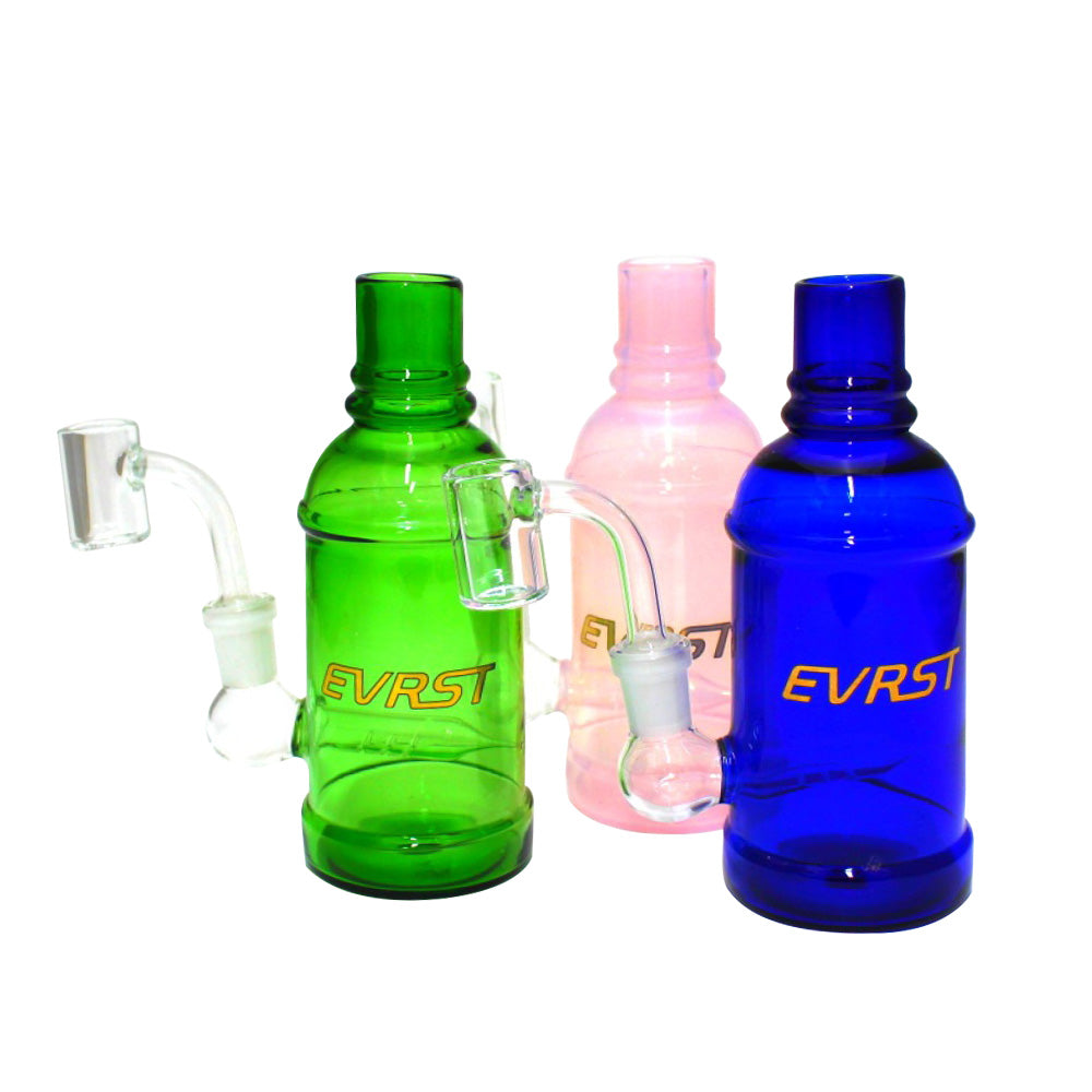 EVRST bottle dab rig water pipe with 14mm male banger, durable glass construction with water filtration system and compact modern bottle-style design.
