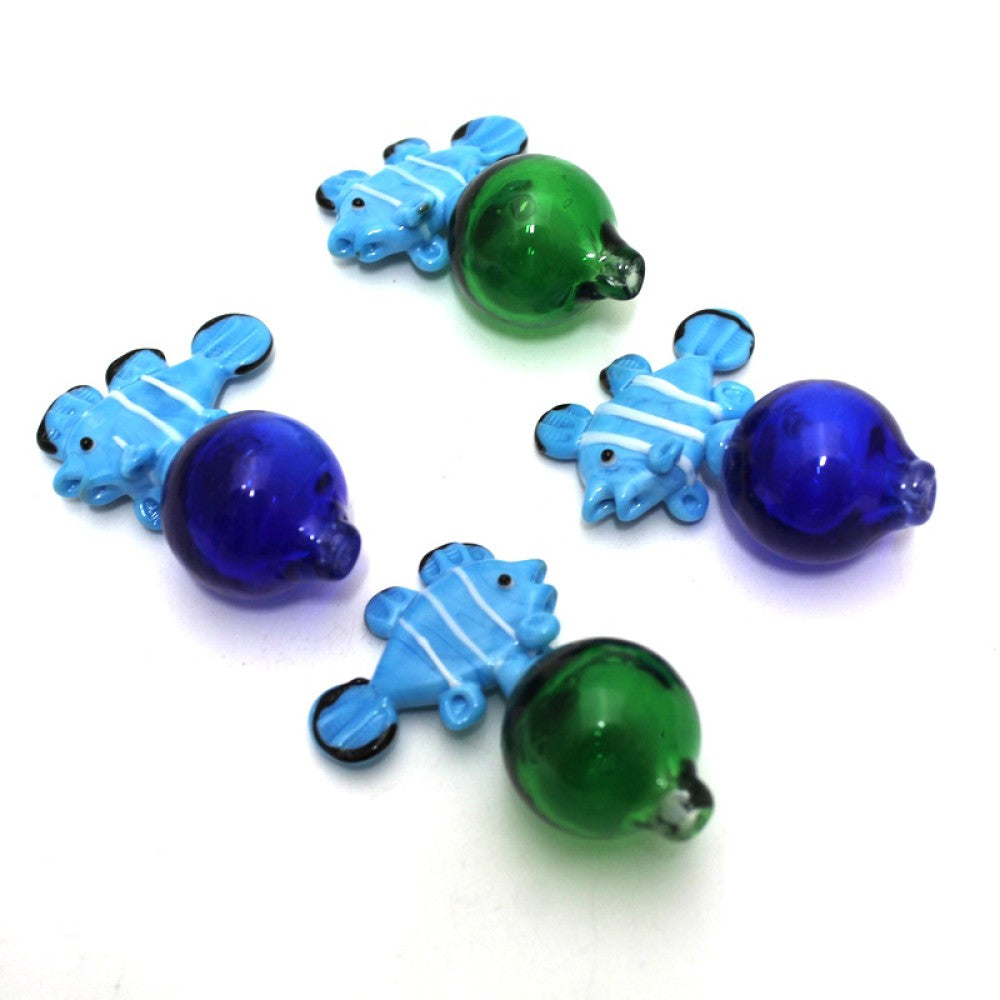 Fish design carb cap made from heat resistant glass for smooth airflow control and quartz banger compatibility.