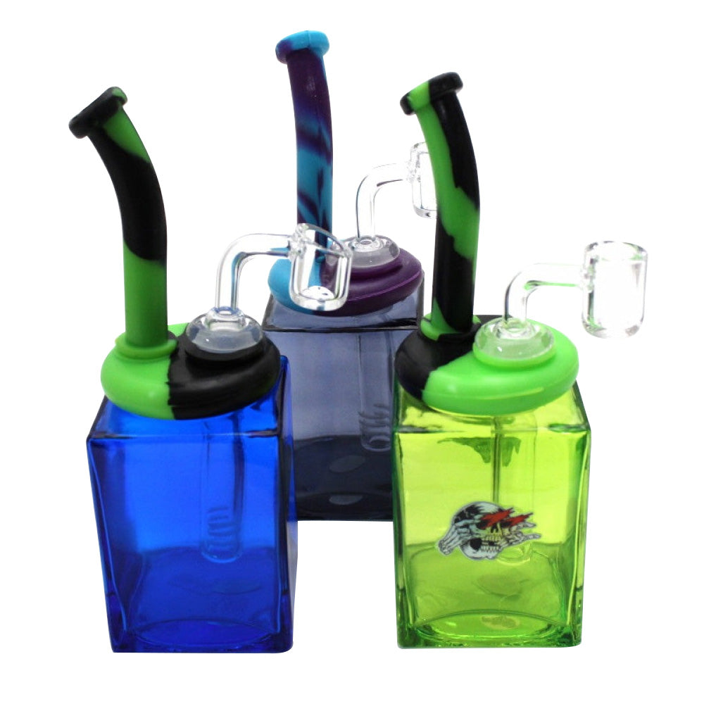 Glass square dab rig with a durable silicone top and 14mm male quartz banger, designed for smooth filtration and reliable concentrate sessions.