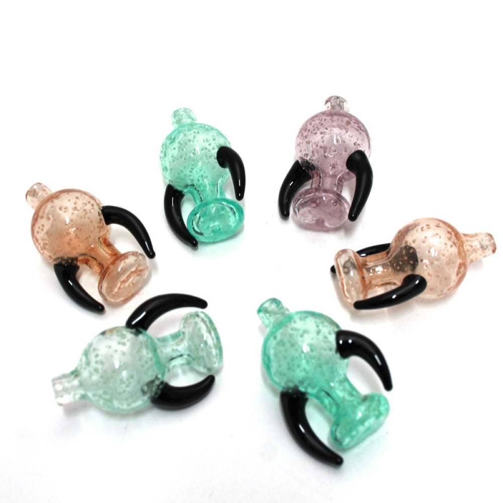 Glow in the dark horn design carb cap made from heat resistant glass for smooth airflow and vapor control.