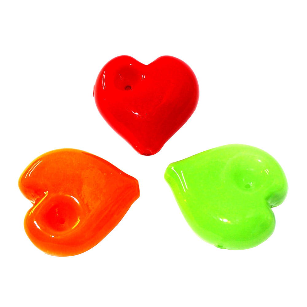 Heart shaped glass hand pipe with fancy design, durable heat-resistant glass build, smooth airflow, and compact portable smoking accessory.