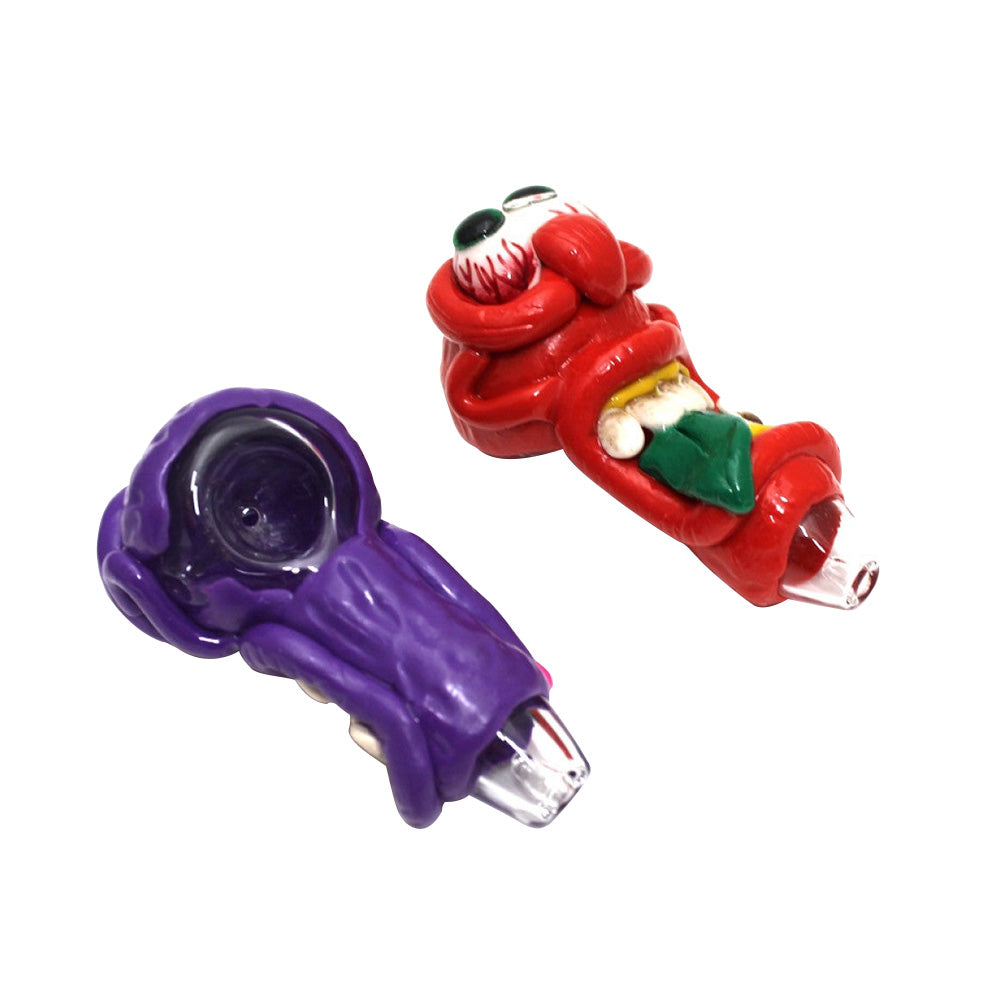 Monster design art heavy duty glass hand pipe featuring thick durable glass construction and detailed handcrafted artistic accents.