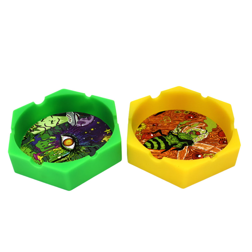 Silicone round ashtray 4 x 4 inch decal design, durable heat-resistant and flexible tray with decorative finish and deep grooves for easy ash disposal.