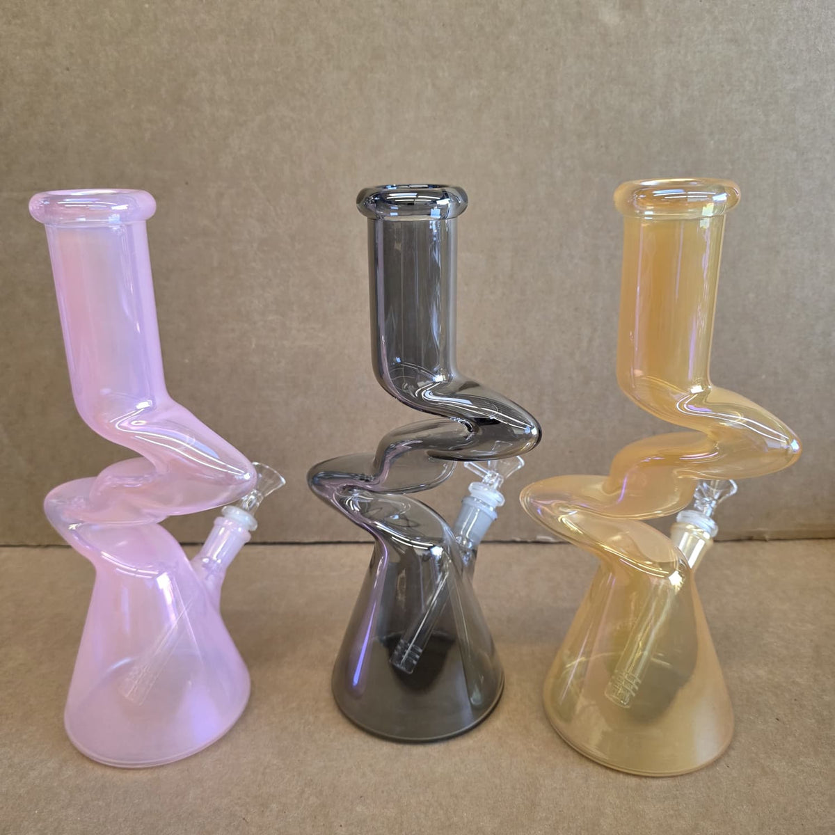 Angled profile showing wide stable beaker base chamber and translucent colored glass finish
