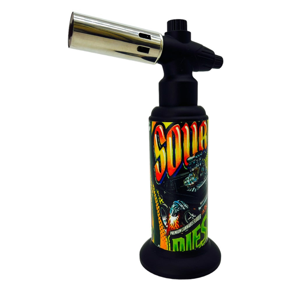 Techno slant torch lighter in clamshell packaging with angled flame design, durable body, and strong butane ignition system.