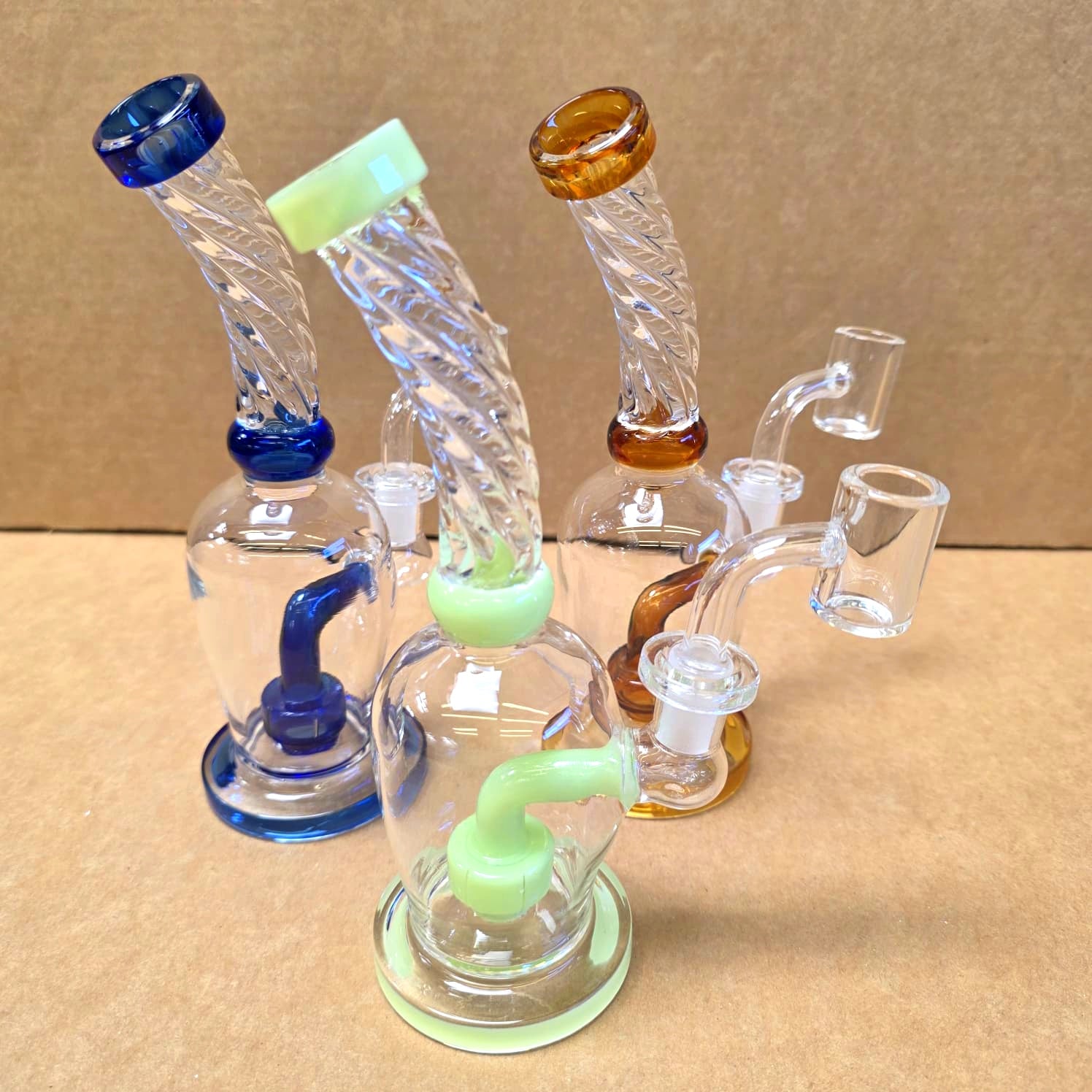 Flat bottom twisted top water pipe with 14mm male banger, durable glass build with stable base and smooth water filtration system.